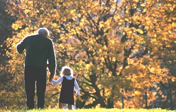Older man walking with child